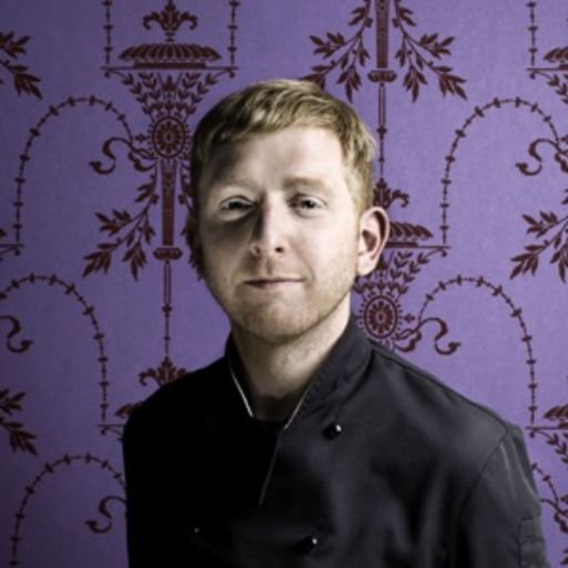 Paul A Young purple portrait cropped