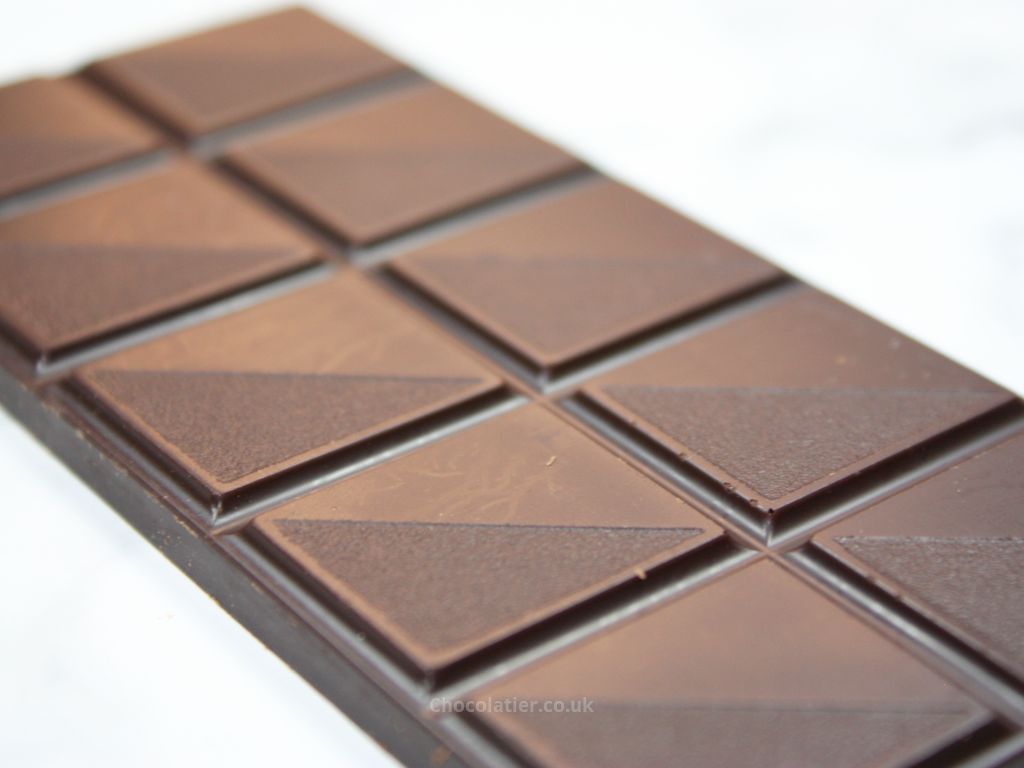 Closeup of Divine Organic 85% Rich Dark Chocolate with Refreshing Lemon bar