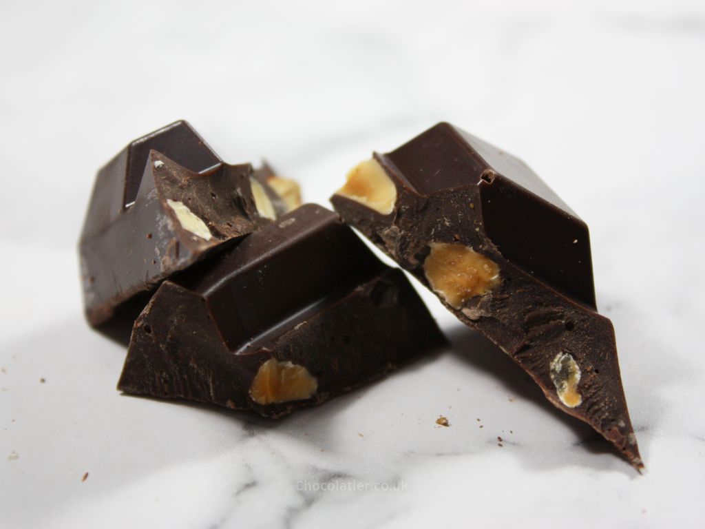 Pieces of Tony's Chocolonely Sea Salted Almond 51% Dark Chocolate